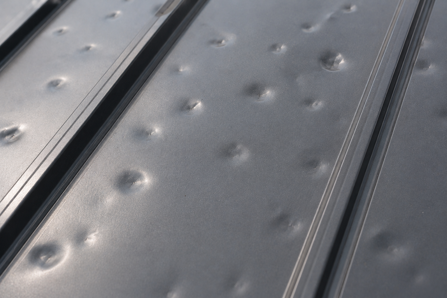 matal panel dameged by hail